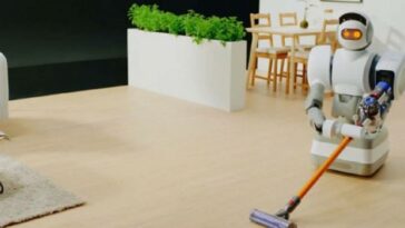 robot domestique faisant le ménage avec un aspirateur balai