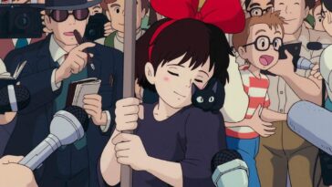 Kiki entourée de journalistes avec son chat Jiji dans ce film Ghibli