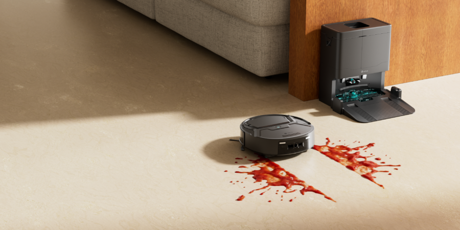 Le robot aspirateur-laveur Lefant M210 OMNI lavant une tache de sauce sur le sol près de sa station.